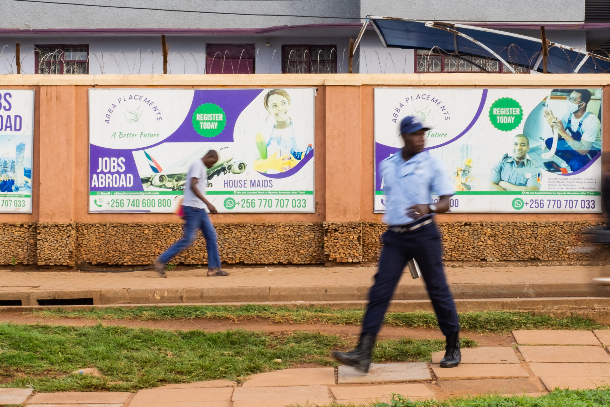 Billboards in downtown Kampala advertising jobs abroad and a better future. Photo by Badru Katumba